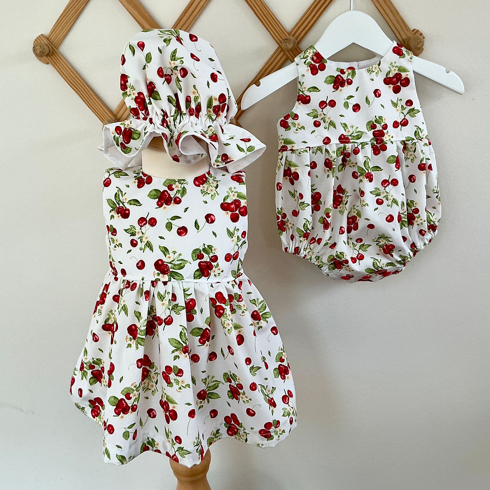 Thumbnail: Cherry Print Victorian Style Mop Bonnet with dress and romper in matching print