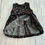 Thumbnail: Girls Rainbow Shooting Stars on black Sleeveless dress flat lay showing hem detail