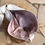 Thumbnail: Handmade boho vintage bag made from human hair, showcasing vegan fashion and elegant pink luxury design. Ethical statement ag