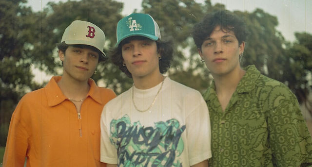 Sturniolo Triplets performing live on stage in 2025