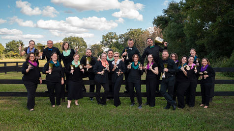 The Magic of Bronze are ringing the bells at the Holiday Soiree in the Milk District