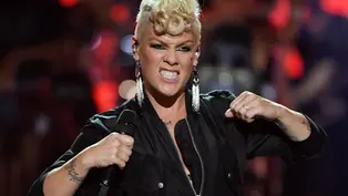 Pink reacts with anger to Nazi demonstrators outside entrance to Walt Disney World