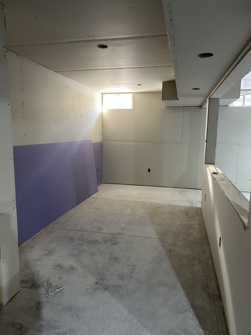 Sheetrock all hung and ready for mud in this basement kitchen.