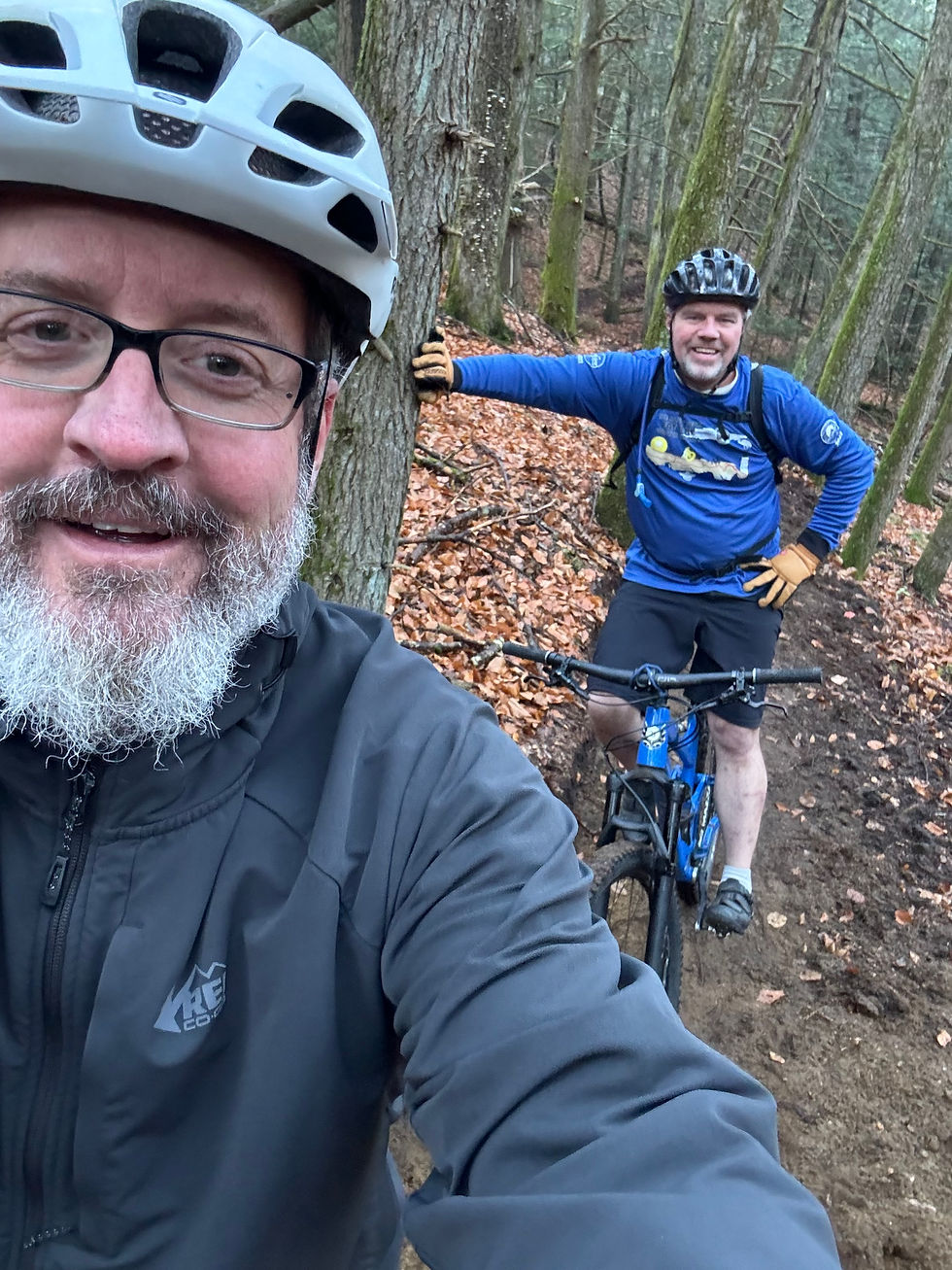 Dan and Scott Wieting mountain biking. This photo is an example of his “selfie” technique, which he often claimed to have invented.