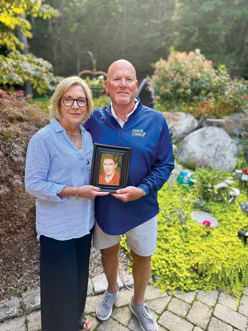 Lisa and Scott Johnson hold a circa 2015 picture of their son Connor Johnson. They lost him the next year. Their non-profit, Honor Connor / Hold Onto Hope works to prevent suicides, counsel those affected by it, reduce the stigma around mental health, strengthen connections and promote healthy outlets.