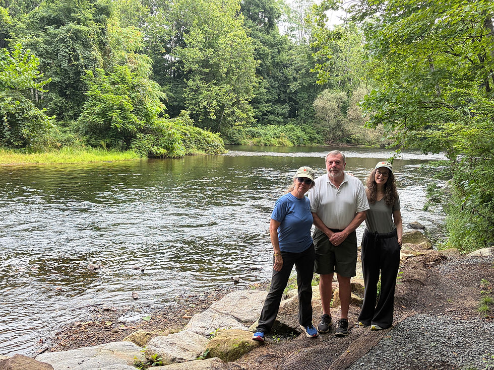 Standing on the old pier site in front of Goat Island are, from left: Capital Campaign Co-Chair Cate Grady-Benson, Project Manager Steve Nelson, and FLT Executive Director Kristin Flyntz.