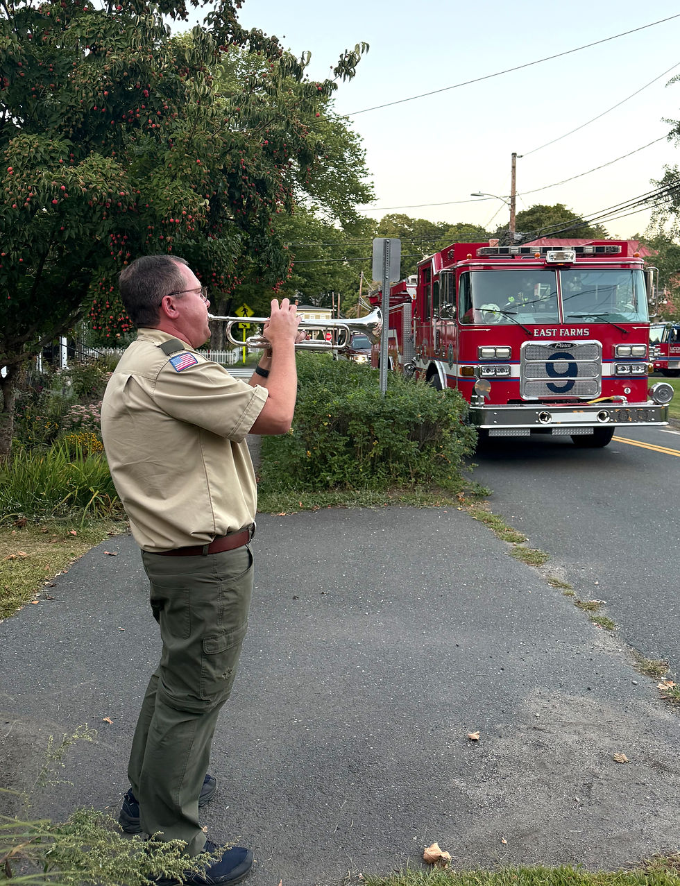 Assistant Scout Master David Tabol playing Taps