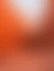 switchbacks descending between towering orange and red canyon walls at dawn