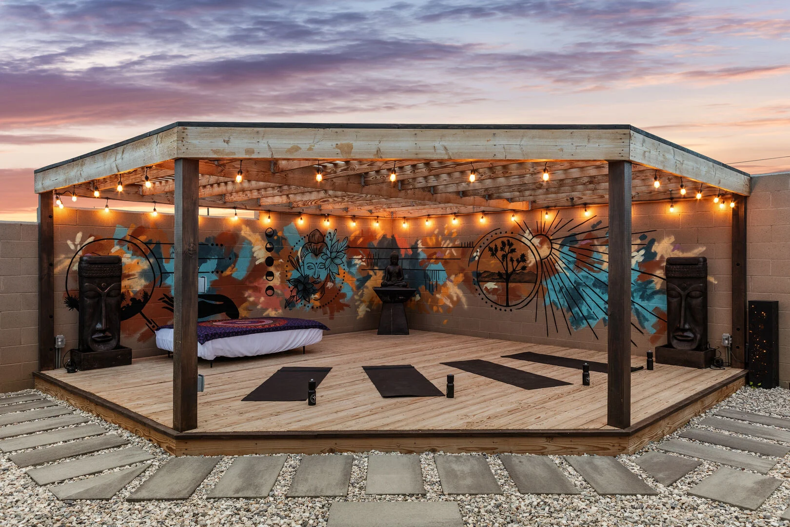 yoga deck with wooden floor and ceiling illuminated during sunset 