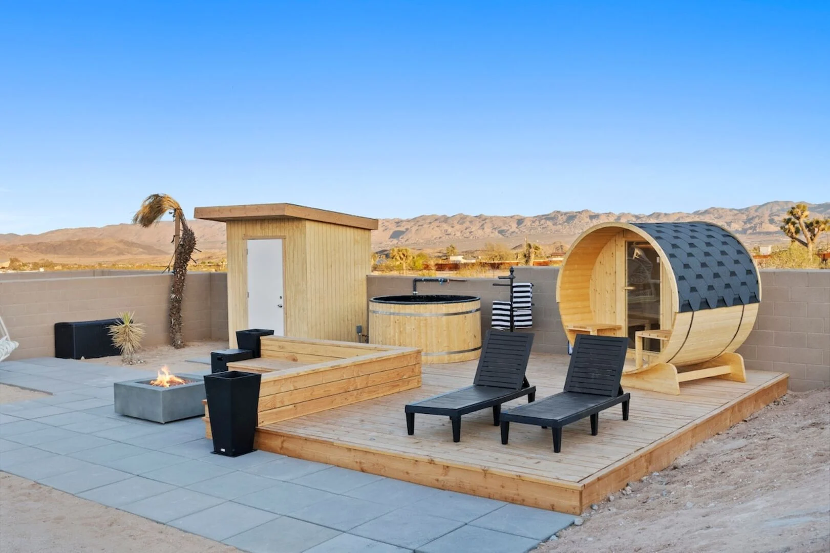 outdoor cold plunge, fire pit, and sauna at a desert vacation Airbnb 