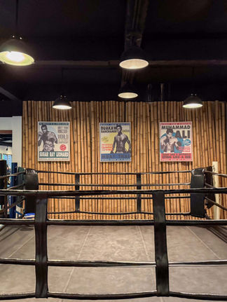 thai boxing ring with famous posters of boxers on a bamboo wall at the gym at Sri panwa