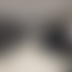 gym equipment and treadmills inside a minimalist hotel gym