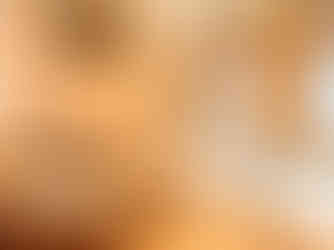 3 lounge chairs with towels neatly placed at the edge next to a hot tub with vaulted floor to ceiling arched glass windows 