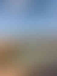 stone bridge and walkways surrounding the lazy river in the Joshua Tree desert Airbnb 