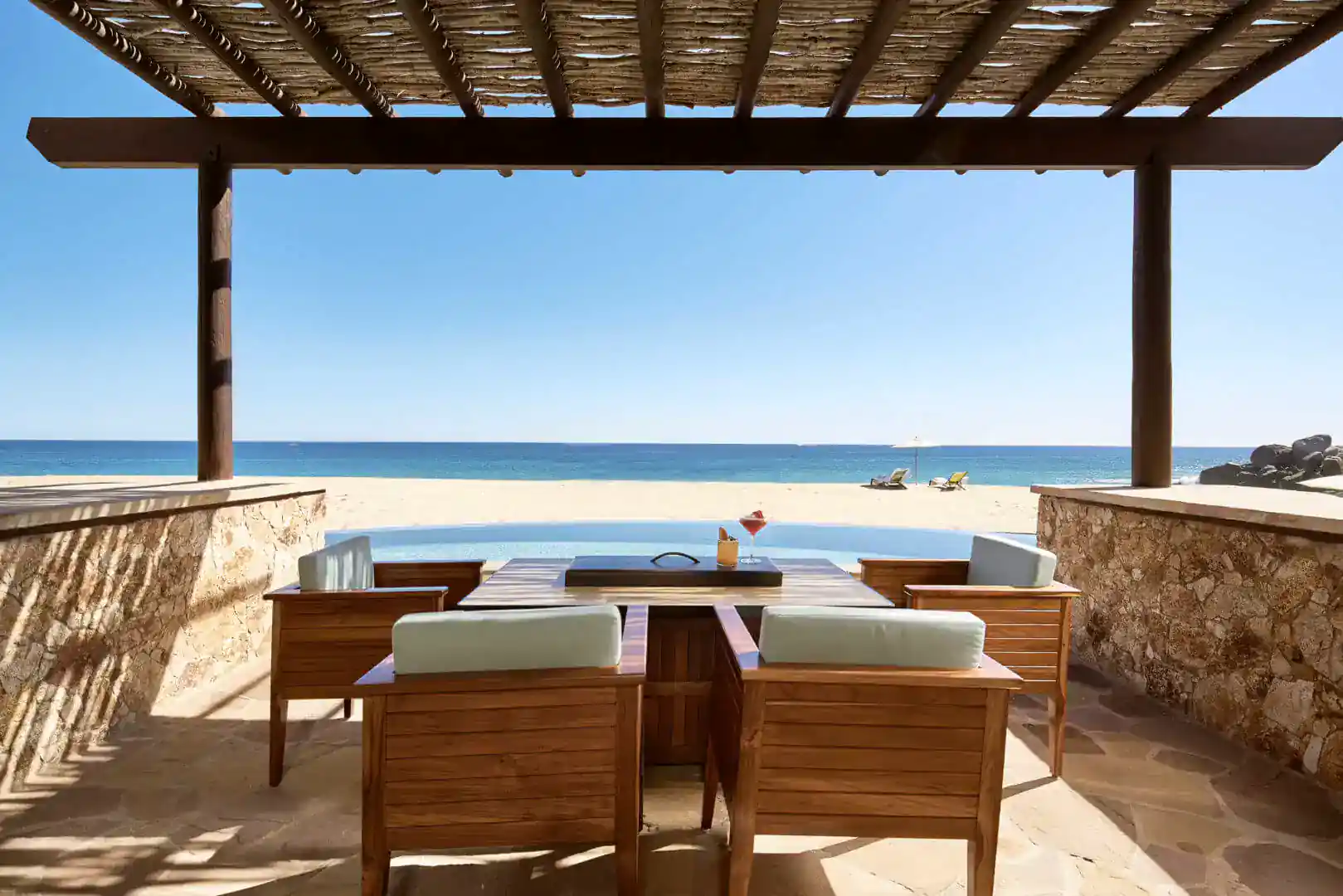 guest room outdoor balcony overlooking the beach at the Waldorf Astoria Cabo