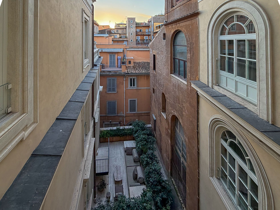 Courtyard balconies overlooking sunrise over Rome 
