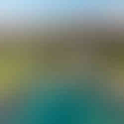 aerial view above the Fairmont Orchid Resort showing the expansive hotel towers and beaches surrounded by the natural landscape so the Big Island