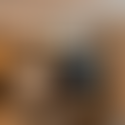 white linen kind side bed behind a tv stand and media console 