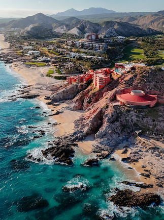Aerial view of the coastline in caboose surrounded by Rocky Mountains and hotels