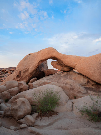 Arch Rock under soft morning light and blue sky