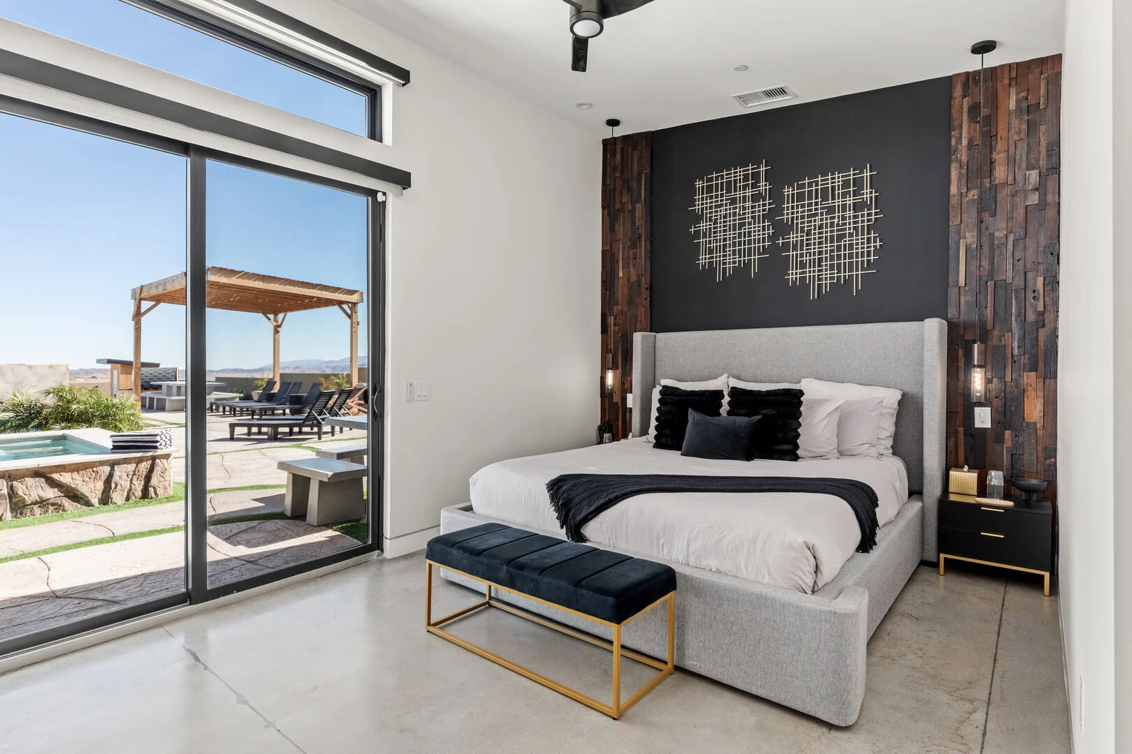 large king bed bedroom with large glass sliding doors and modern interior decor