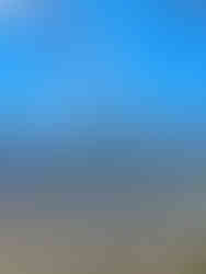 smaller volcanic peaks sticking up above the mountain green hillside