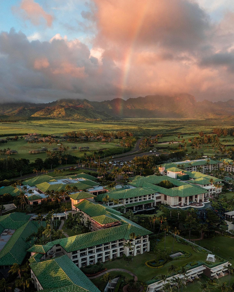 rainbow in the Kauai mountain ridges behind the lush grand Hyatt kauai
