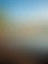 calm blue ocean waters in the lagoon surrounded by white lounge chairs on the beach under the palm trees