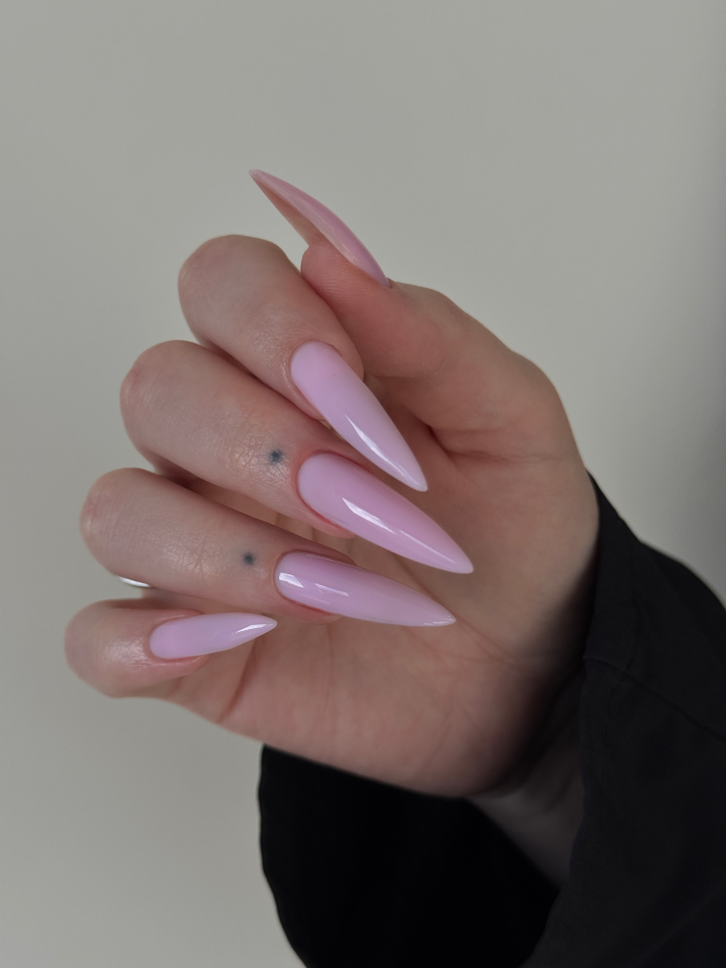 Long stiletto nails featuring Pink Mask Hard Gel.