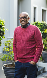 Man_Standing_By_Garden_Hedge_original_3750376.jpg