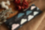 colorful fabric encasing an herbal eye pillow.