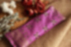 colorful fabric encasing an herbal eye pillow.