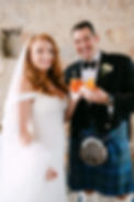Bride and groom drinking spritz