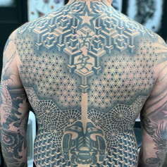 Intricate shape back tattoo