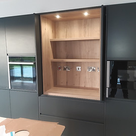 Downlights fitted to a kitchen unit