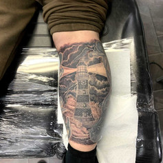 Tattoo of a lighthouse