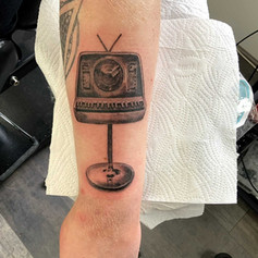 TV on a stand tattoo