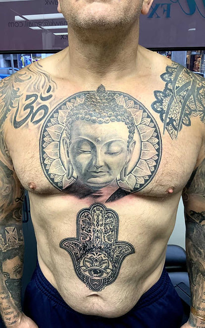 Hindu imagery tattooed on mans chest