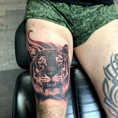 Tiger Tattoo on persons right thigh