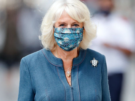 Camilla wears a mask on visits around London
