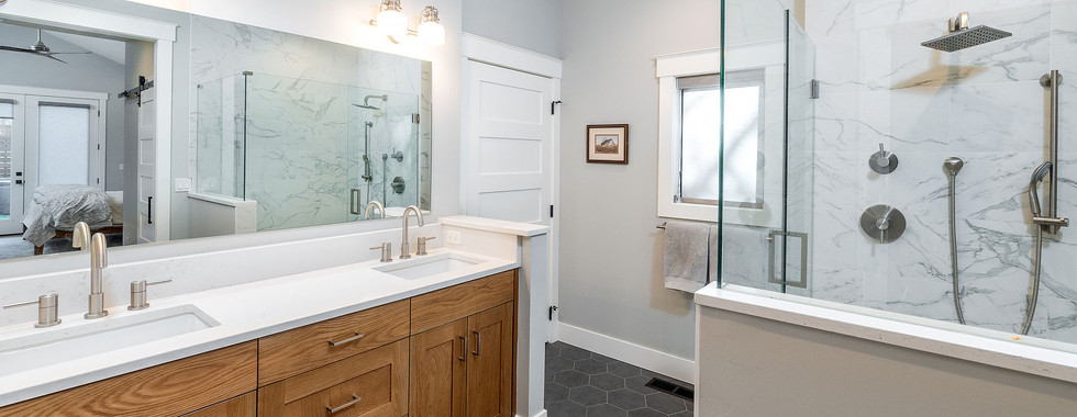 Primary Bathroom With Walk In Shower built by PGC Building + Design luxury custom home builder in Bend