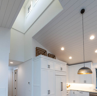 clear story in the kitchen for added natural light in a modern farmhouse style home remodel in Bend by PGC Building + Design