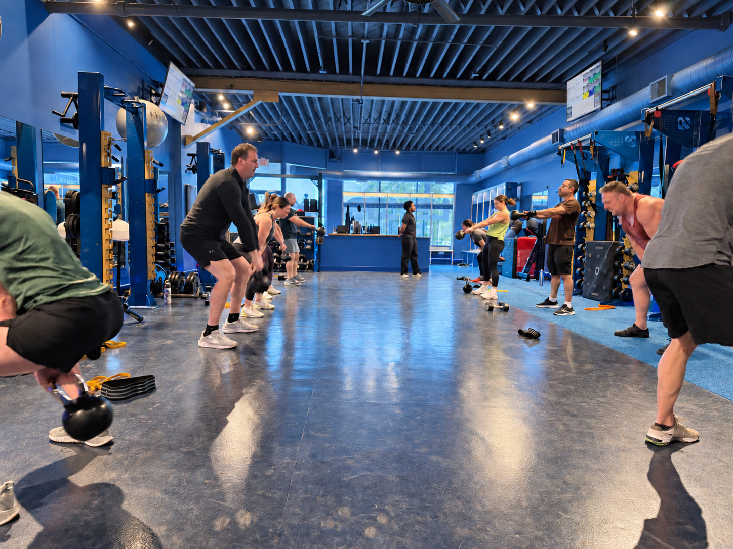 LEAP members training together with kettlebells on the main training floor in East Lakeview, Chicago