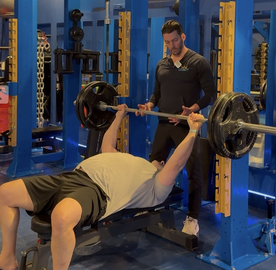 Elias Sabbagh bench pressing with Coach Matt at LEAP