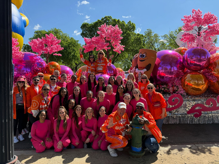 Our 2026 parade performers with the Dunkin' float, which was our partnered float!