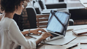 woman typing on computer