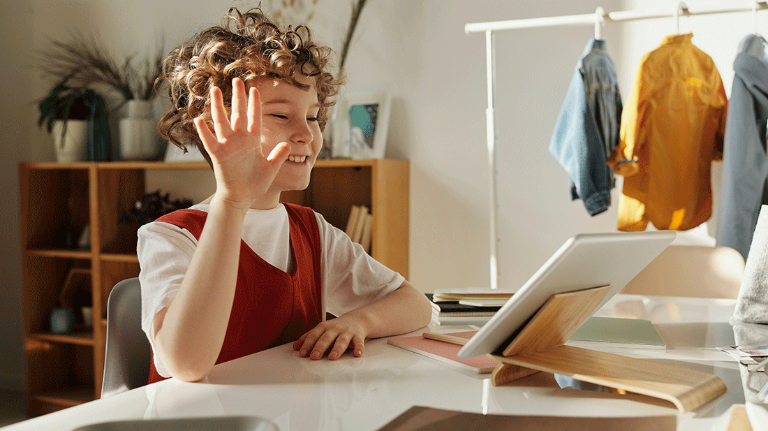 photo-of-child-smiling-while-using-tablet-computer-4145032.gif