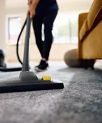 cleaning-lady-vacuuming.webp
