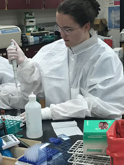 Elizabeth  Burkhead performing lab activity