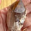 Thumbnail: Raw natural phantom quartz with hematite point, rare record keeper